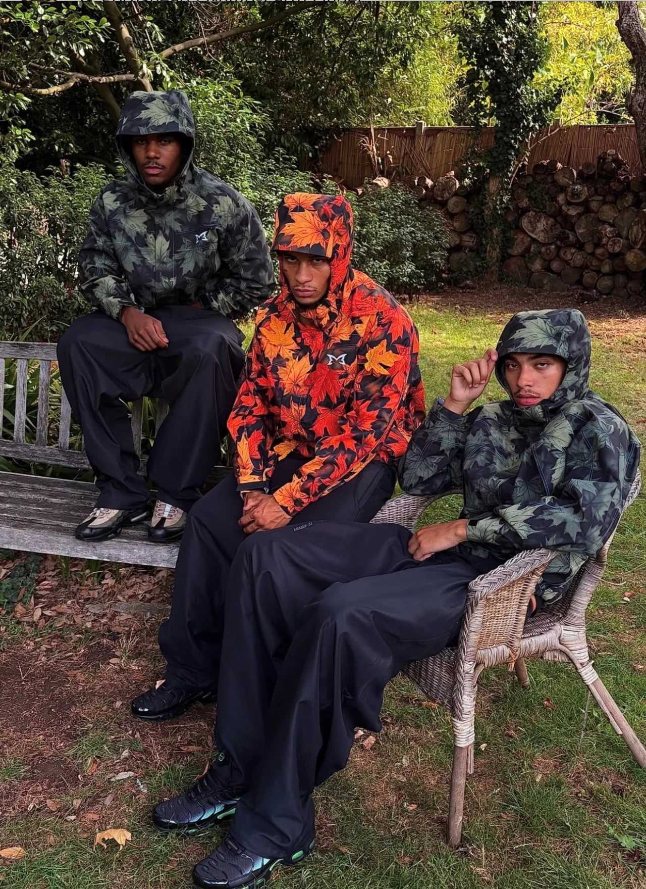 Outdoor group fashion shoot featuring three models in patterned hooded jackets