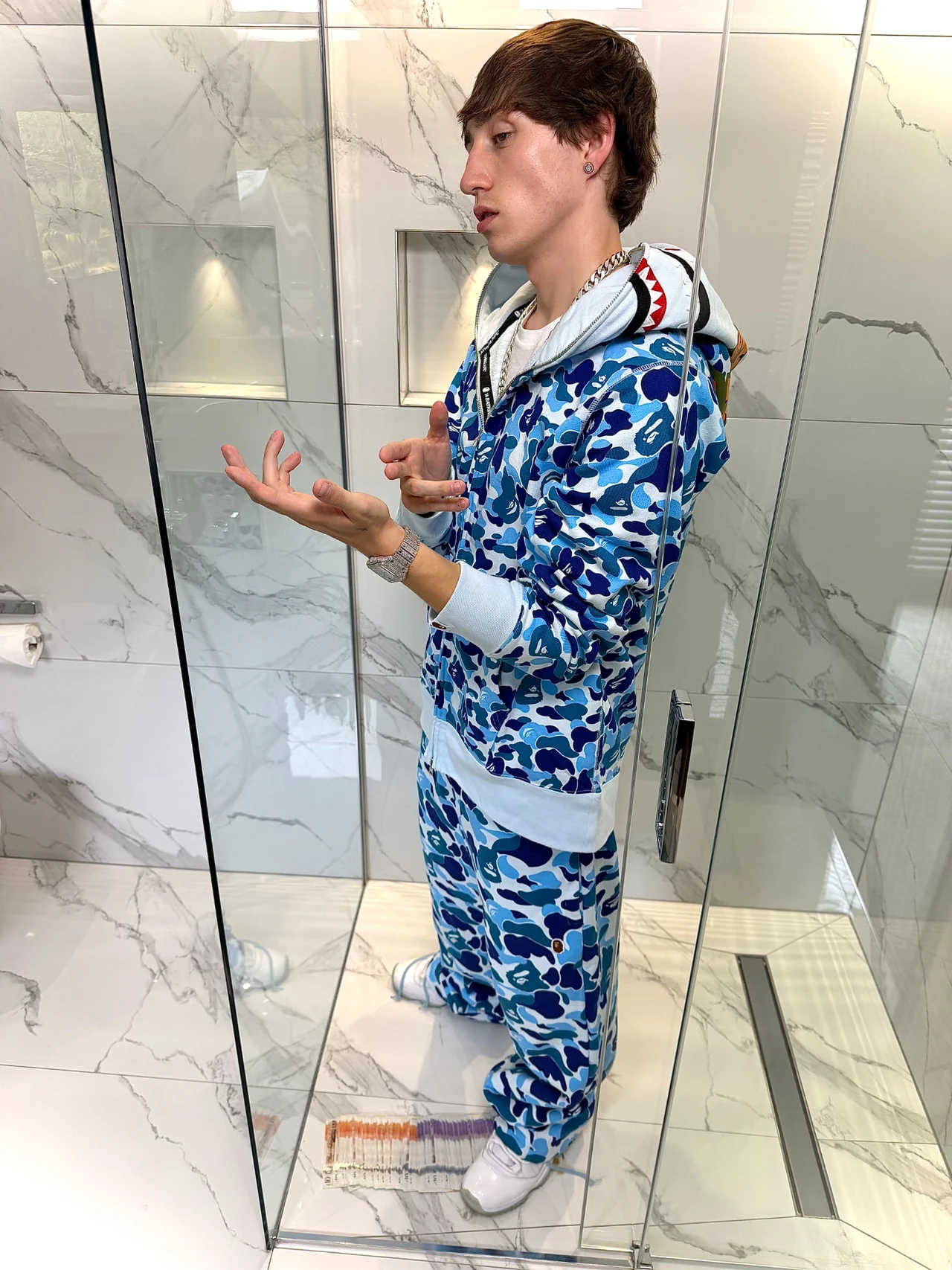 TED wearing a blue Bape tracksuit